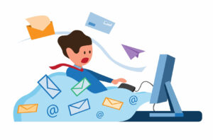 Cartoon image of a person sitting at their computer desk with notifications flying out of the screen at them